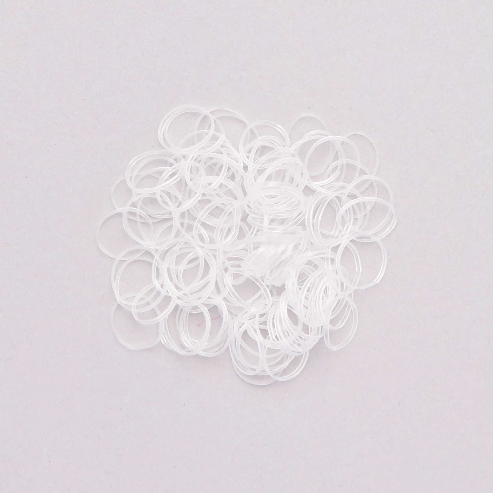 Pack of 100 transparent elasticated hair bands transparant